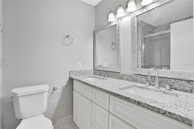 bathroom with vanity, an enclosed shower, and toilet