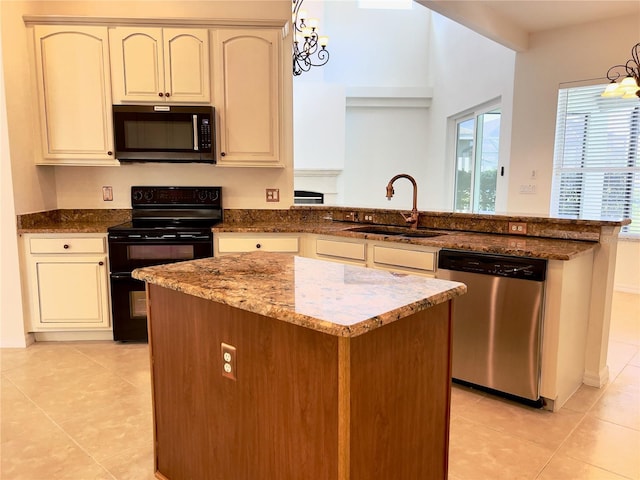 kitchen with sink, an inviting chandelier, a center island, stainless steel dishwasher, and range with two ovens