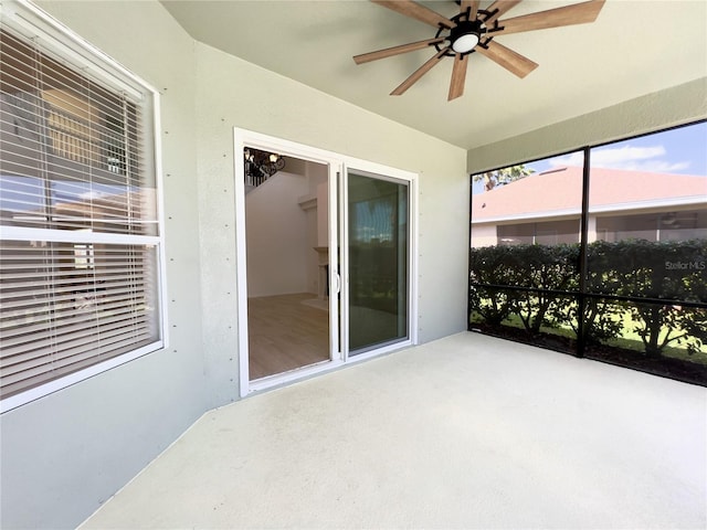 sunroom / solarium with ceiling fan