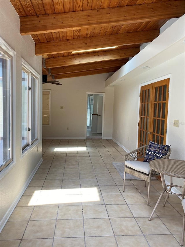 interior space with beam ceiling and wooden ceiling