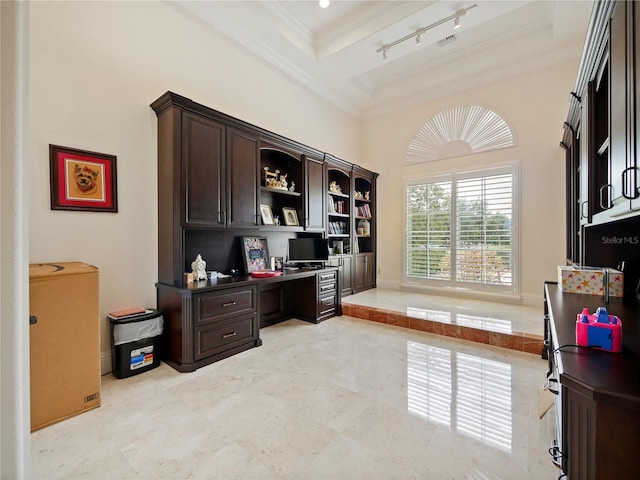 office area featuring beam ceiling, coffered ceiling, crown molding, a towering ceiling, and built in desk