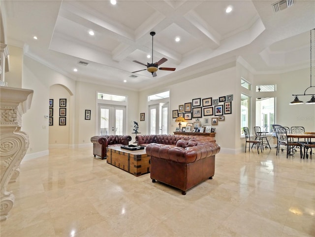 living room featuring french doors, a towering ceiling, ceiling fan, and ornamental molding