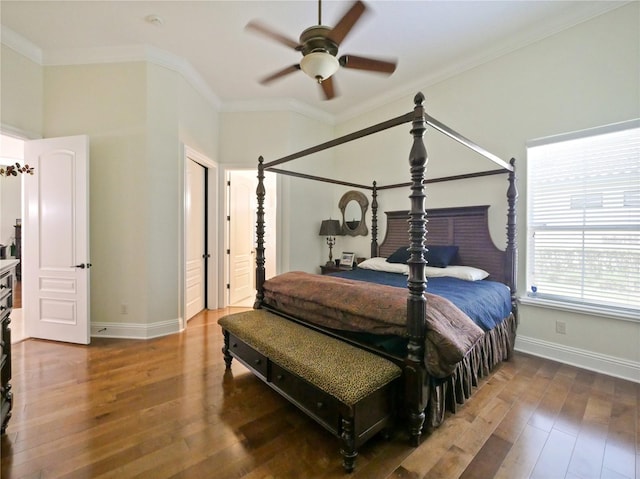 bedroom featuring ceiling fan, crown molding, and hardwood / wood-style flooring