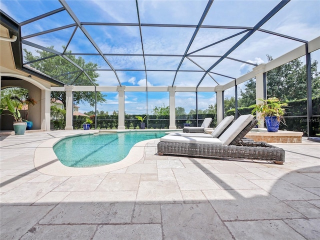 view of pool featuring a patio area and a lanai