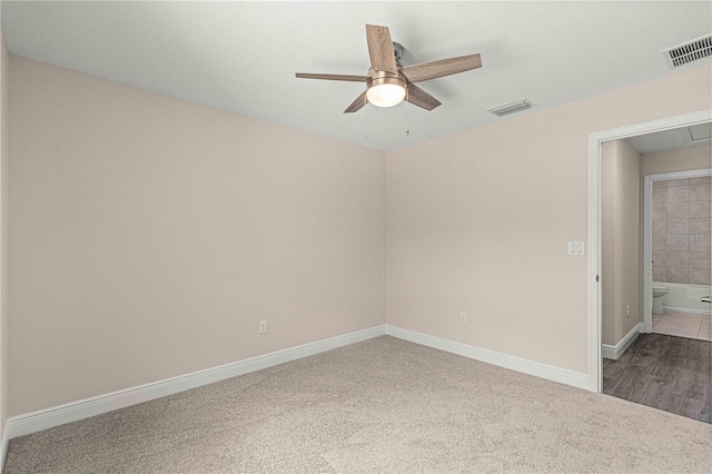 empty room featuring carpet flooring and ceiling fan