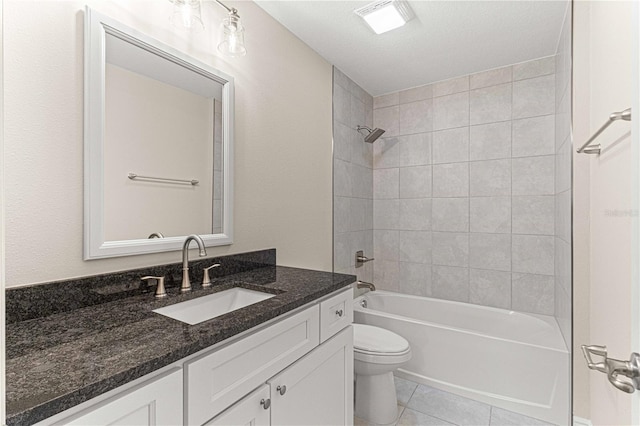 full bathroom with toilet, a textured ceiling, tiled shower / bath combo, tile patterned flooring, and vanity