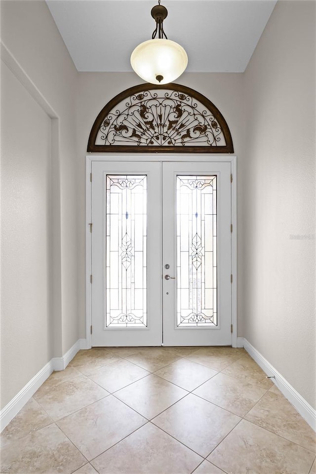 tiled entryway with french doors