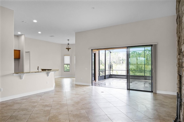 unfurnished room with light tile patterned floors