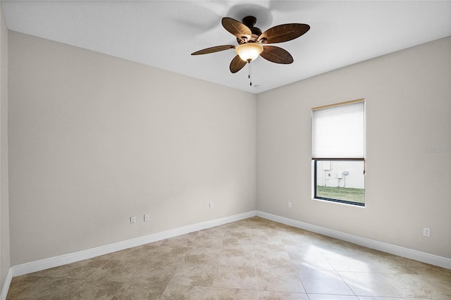 spare room with ceiling fan