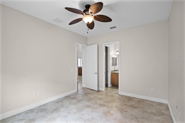 unfurnished bedroom with ensuite bath and ceiling fan