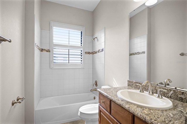 full bathroom with vanity, toilet, and tiled shower / bath combo