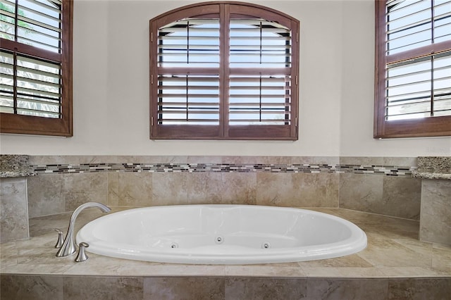 bathroom with tiled bath