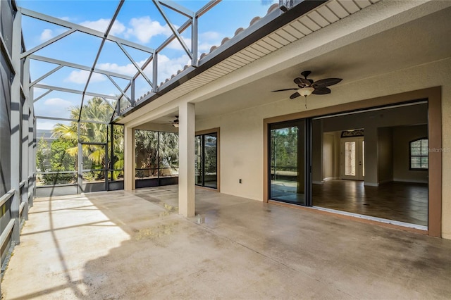 view of patio with a lanai and ceiling fan