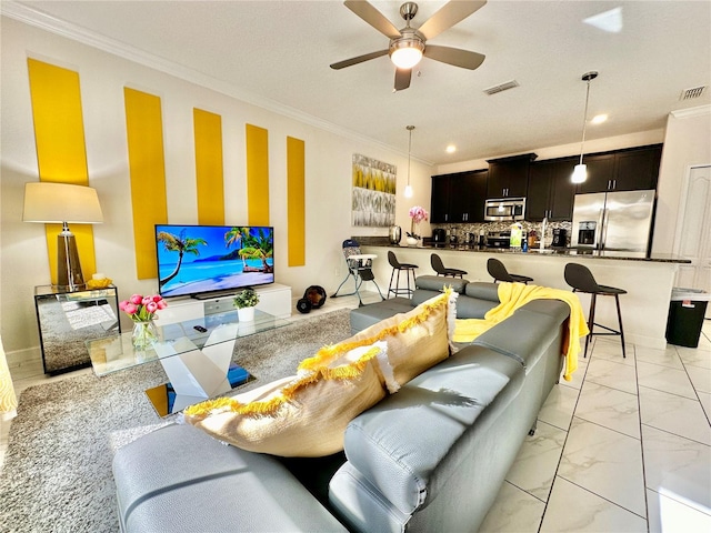 tiled living room with crown molding and ceiling fan