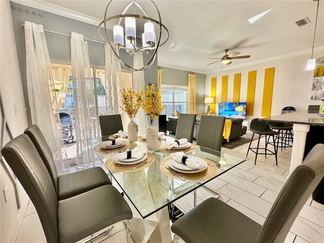 tiled dining area with crown molding and ceiling fan with notable chandelier