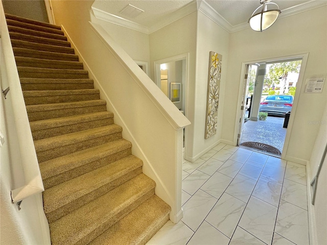 tiled foyer entrance with ornamental molding