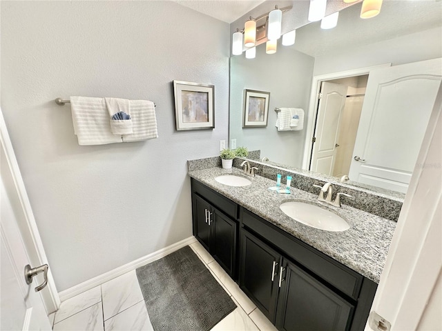 bathroom featuring double vanity and tile patterned floors