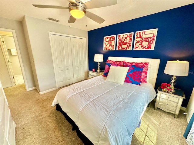 bedroom with a closet, carpet flooring, and ceiling fan