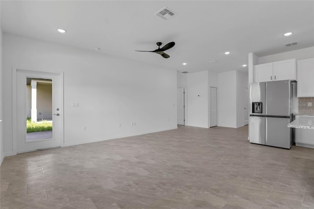 interior space with ceiling fan