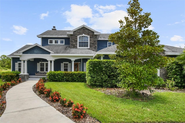 view of front facade featuring a porch and a front yard