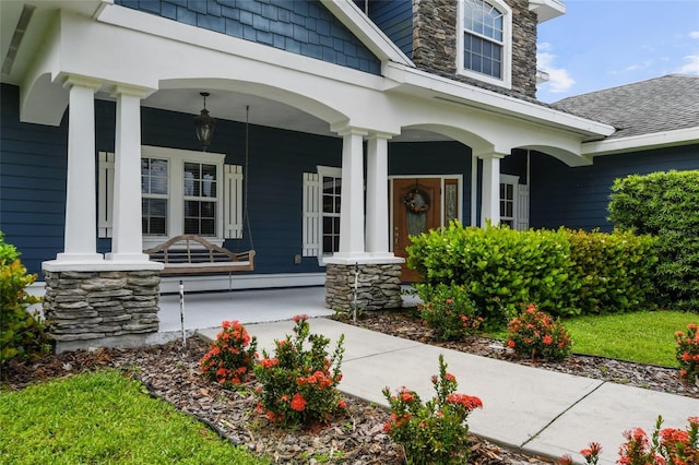 property entrance featuring a porch