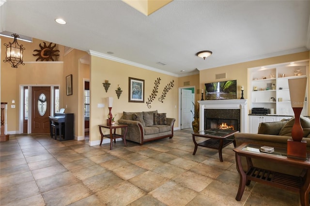 living room with crown molding, a textured ceiling, and built in shelves