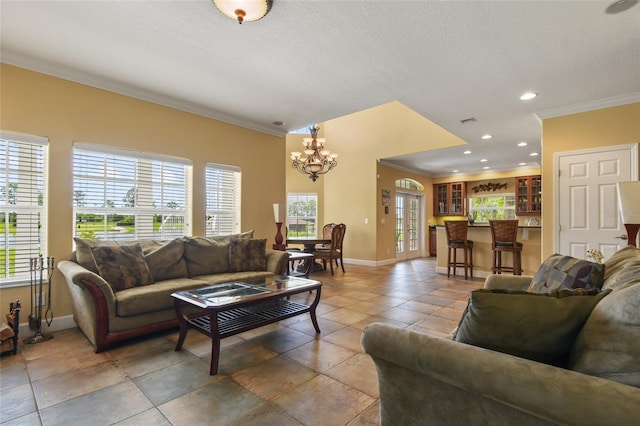 living room featuring crown molding, tile patterned floors, and a chandelier