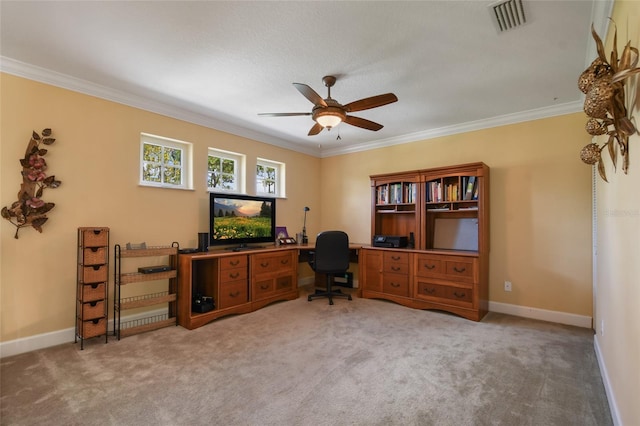 office area featuring crown molding, ceiling fan, and carpet