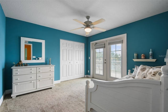 bedroom featuring french doors, light carpet, a closet, ceiling fan, and access to exterior