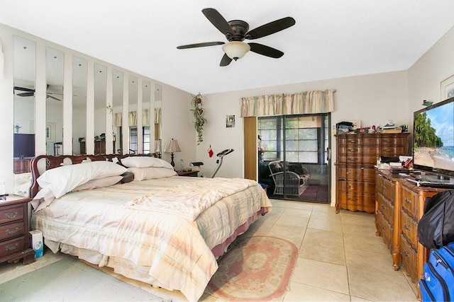 tiled bedroom with access to outside and ceiling fan