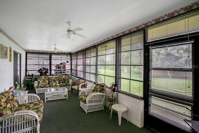 sunroom / solarium featuring ceiling fan