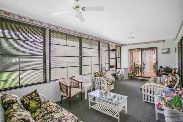 sunroom featuring ceiling fan