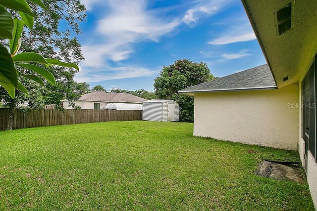 view of yard with a shed