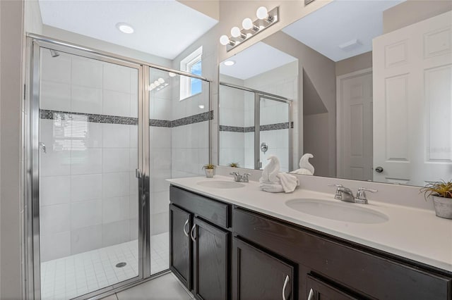 bathroom with walk in shower and vanity