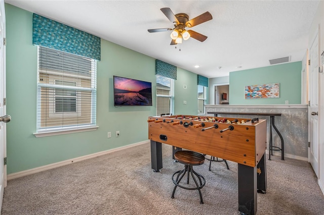 recreation room featuring ceiling fan and carpet floors