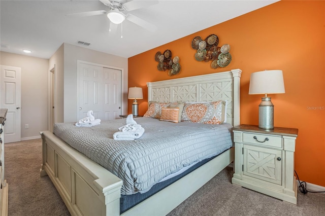 carpeted bedroom with ceiling fan and a closet