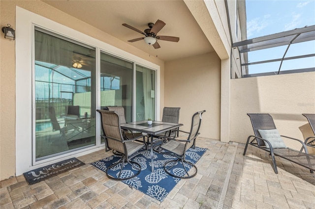 view of patio featuring ceiling fan