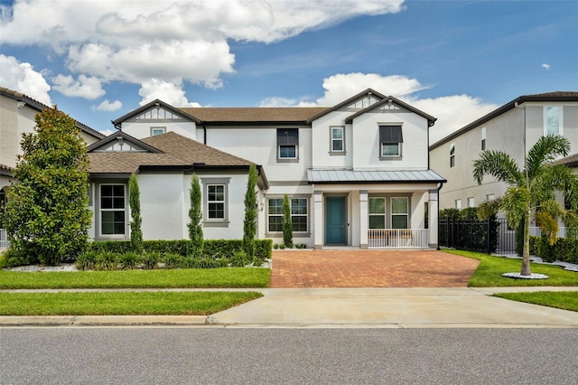 view of front of property with a front yard and a porch