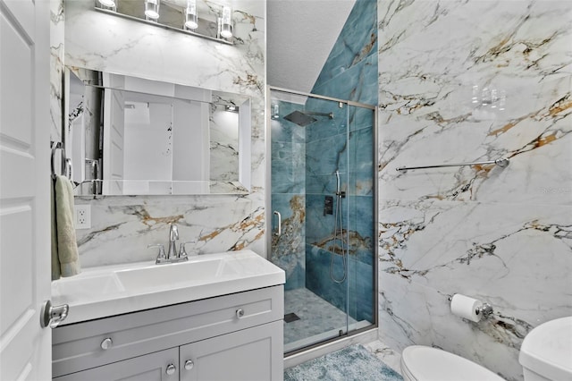 bathroom with toilet, a shower with shower door, a textured ceiling, tile walls, and vanity