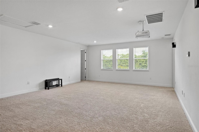 empty room featuring light carpet