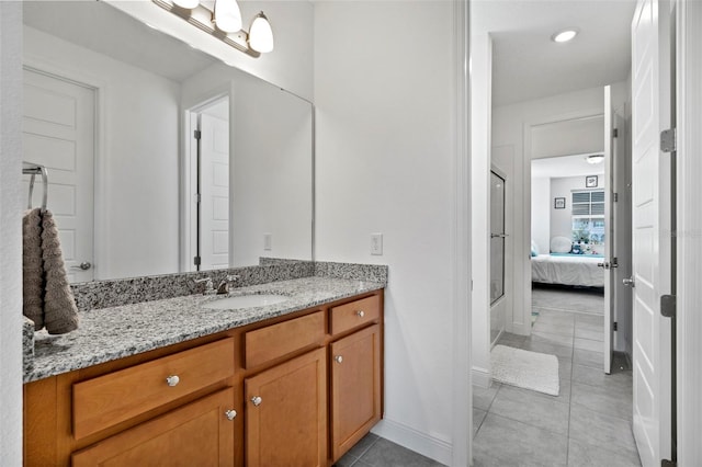 bathroom with vanity and tile patterned flooring