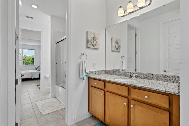 bathroom with vanity, combined bath / shower with glass door, and tile patterned floors