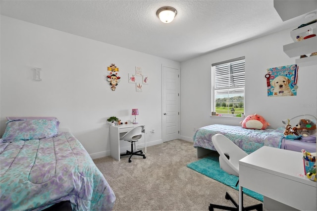 carpeted bedroom with a textured ceiling