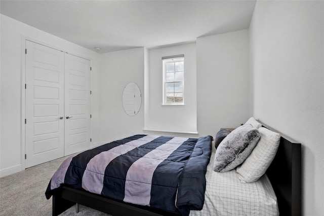 carpeted bedroom with a closet