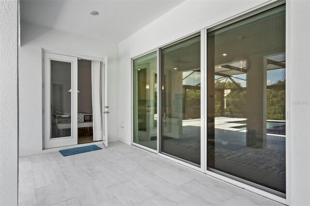 doorway to property featuring a patio