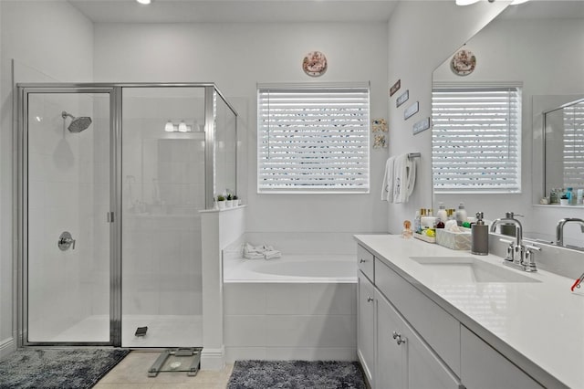 bathroom with vanity, separate shower and tub, and tile patterned flooring