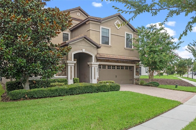 view of front facade featuring a front yard and a garage