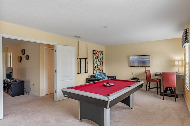 playroom featuring light carpet, billiards, and a textured ceiling