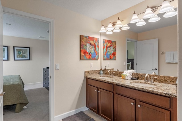 bathroom with vanity and a textured ceiling