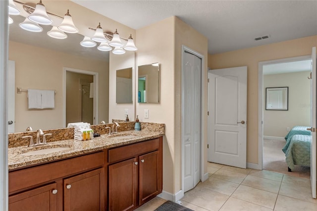 bathroom featuring vanity and tile patterned flooring